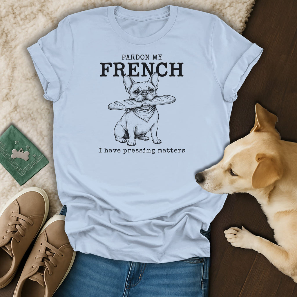 Light blue t-shirt with French bulldog, baguette, and text: "PARDON MY FRENCH I have pressing matters".