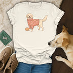 Cream t-shirt with illustrated golden retriever wearing pumpkin sweater and standing next to a pumpkin.