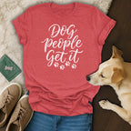 Red t-shirt with "Dog people get it" text and paw prints.