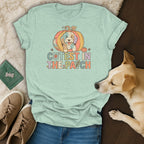 T-shirt with a cartoon dog in a pumpkin and "Cutest in the Patch" text.