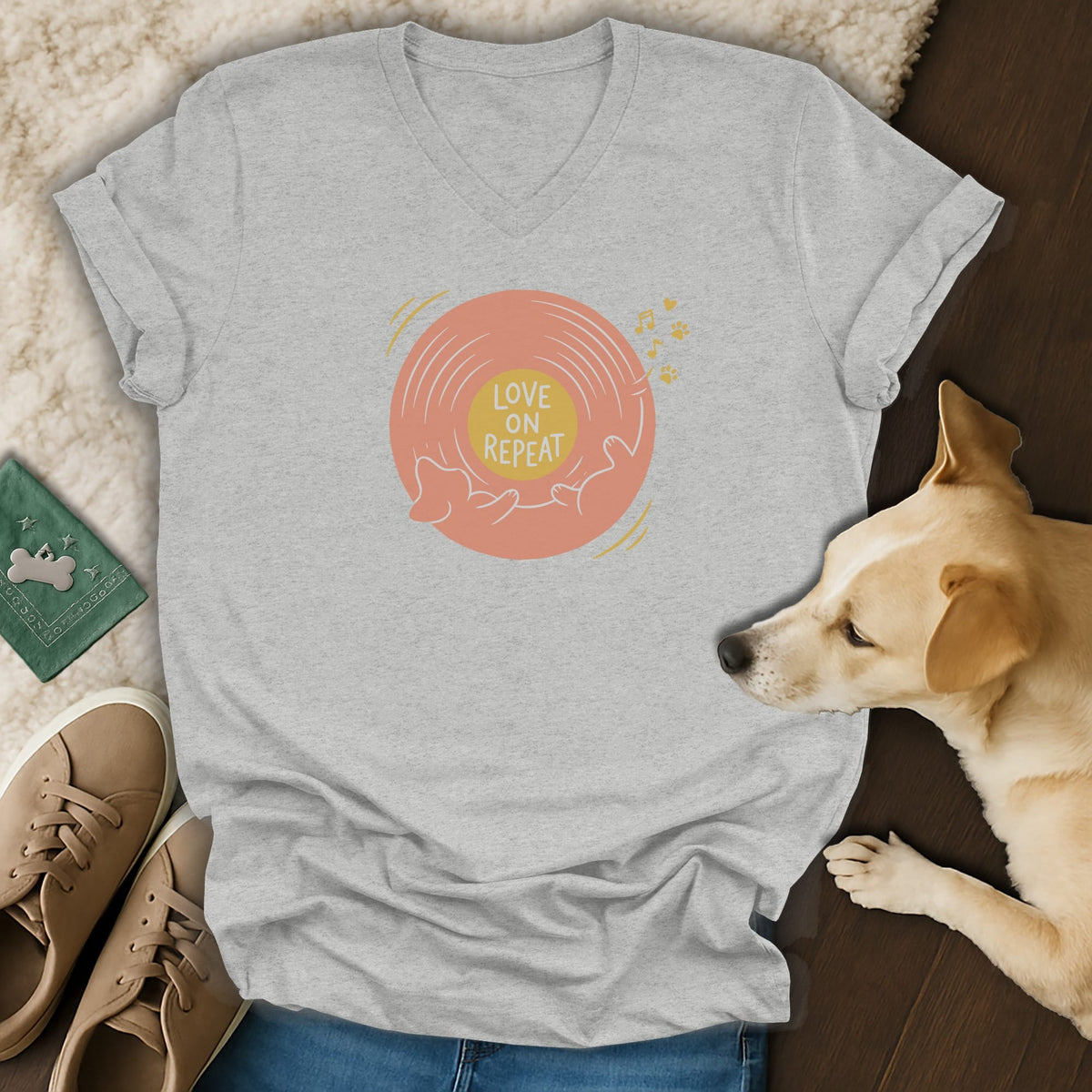 Heather gray V-neck T-shirt featuring a vinyl record graphic with the text "LOVE ON REPEAT".