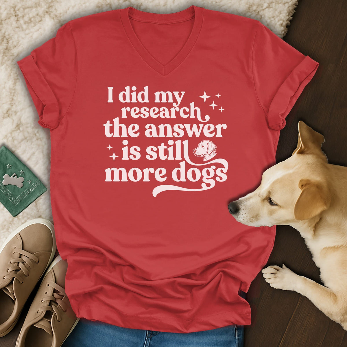 Red v-neck t-shirt with white text "I did my research the answer is still more dogs."