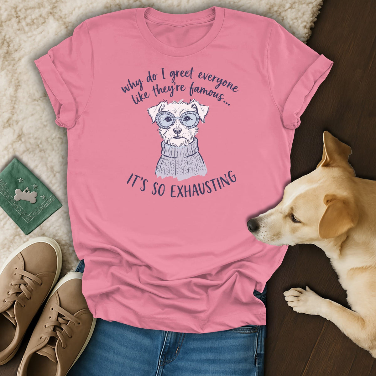 Pink t-shirt with illustration of a dog wearing sunglasses and a sweater, with text.