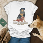 White t-shirt with dog silhouette filled with American flag and patriotic landscape.