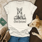 White t-shirt with a sketch of a corgi and pumpkins, text "Feelin' Gourd-geous".