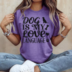Purple t-shirt with "Dog is My Love Language" text and dog paw prints.