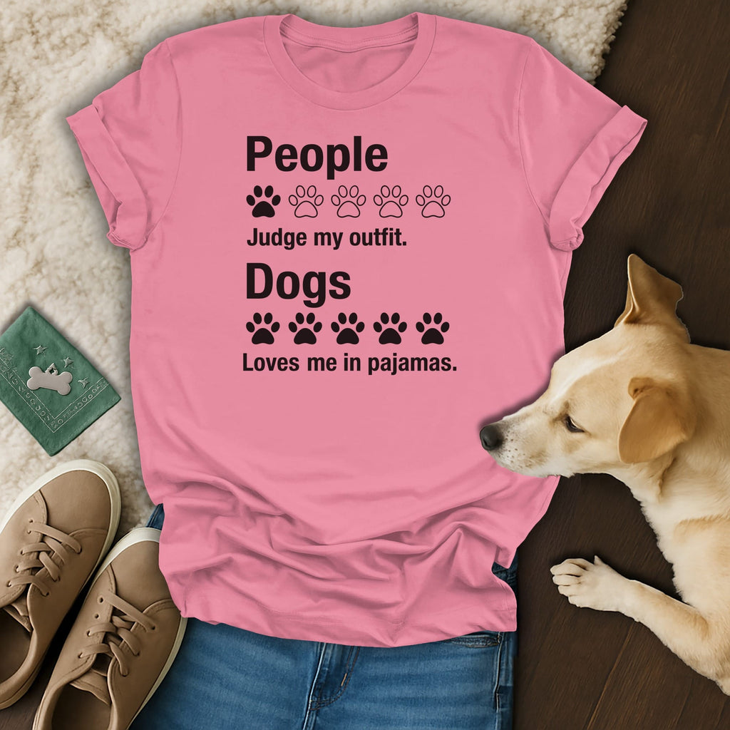 Pink t-shirt with black text: "People Judge my outfit. Dogs Loves me in pajamas."