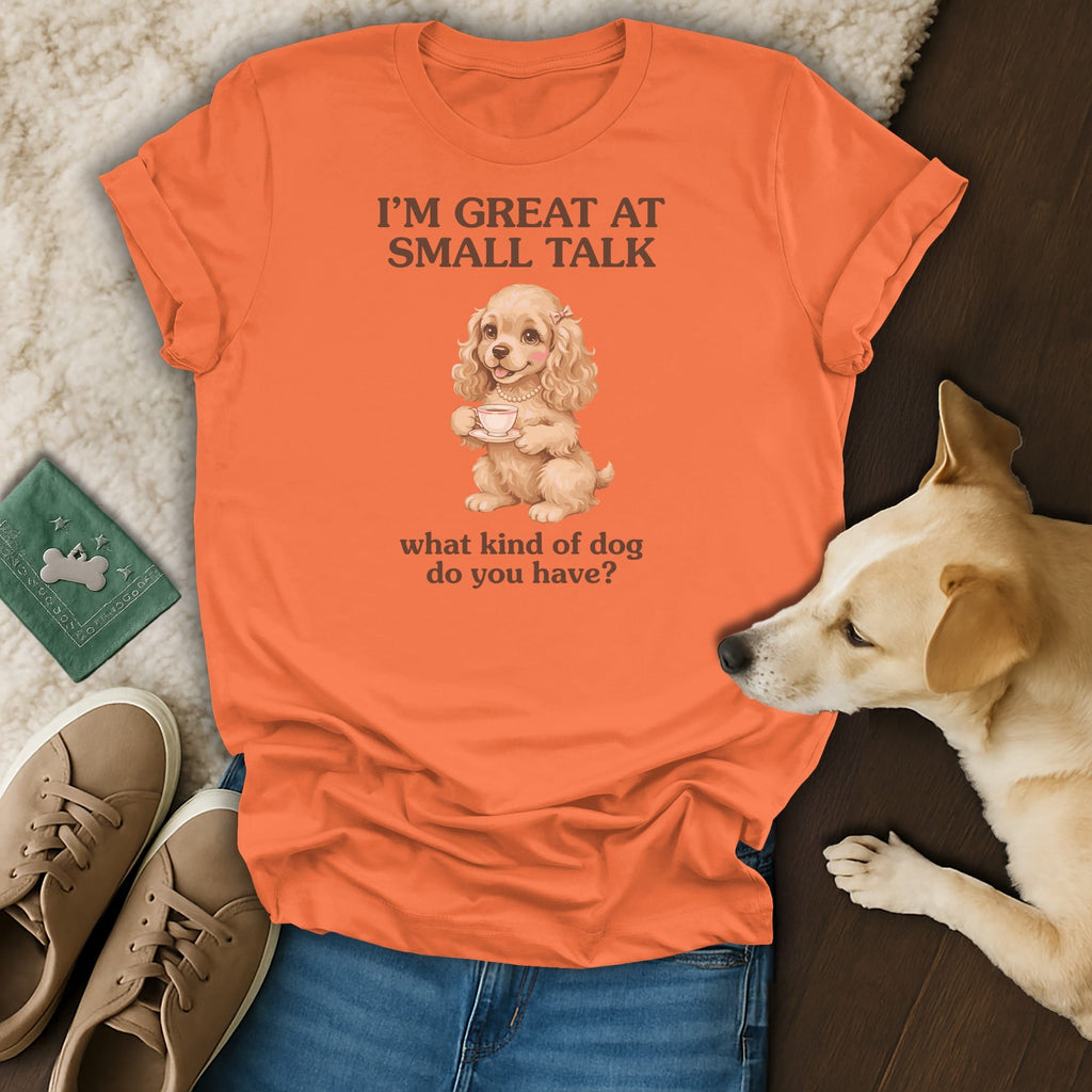 Orange t-shirt with "I'M GREAT AT SMALL TALK" and a dog holding a teacup.