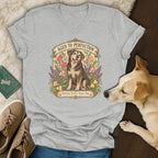 Heather grey v-neck t-shirt featuring a vintage floral graphic of a senior dog and text reading Aged to Perfection.