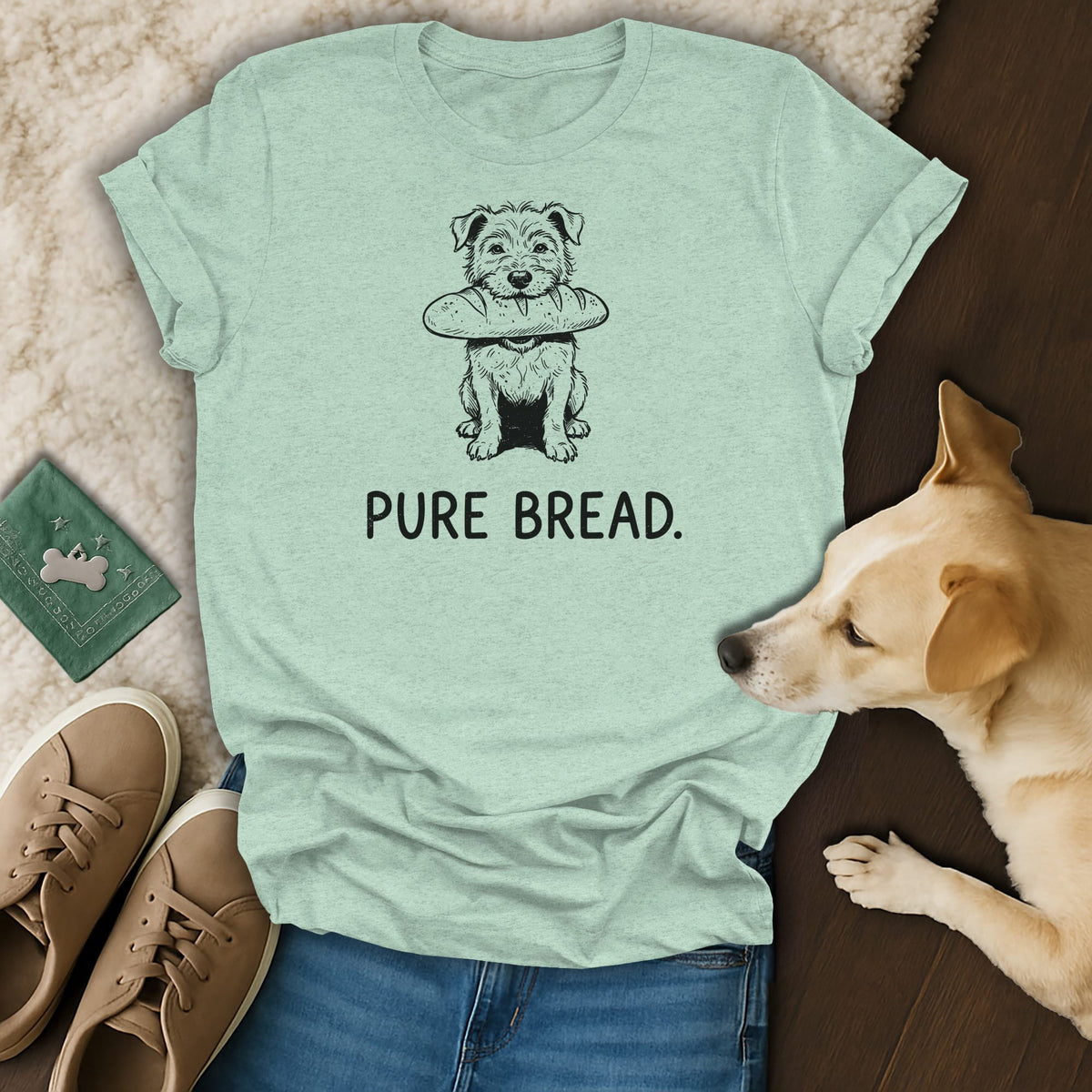 Light blue t-shirt with a line drawing of a dog holding bread and the text "PURE BREAD."