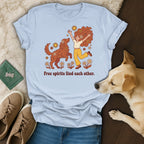 Light blue t-shirt with graphic of woman and dog, text "Free spirits find each other."
