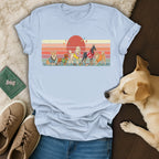 T-shirt with retro dogs and sunset graphic.