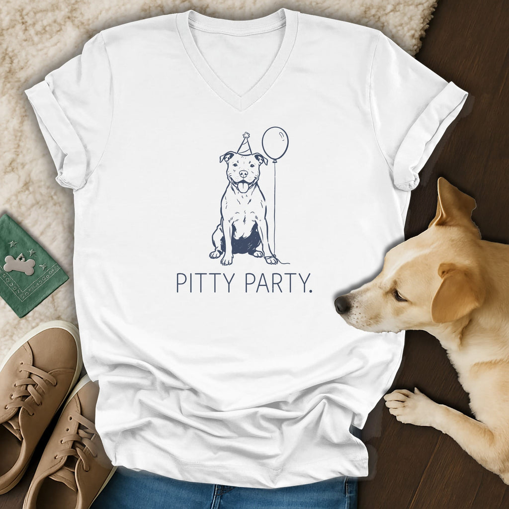 White t-shirt with navy line art of a dog in a party hat holding a balloon.