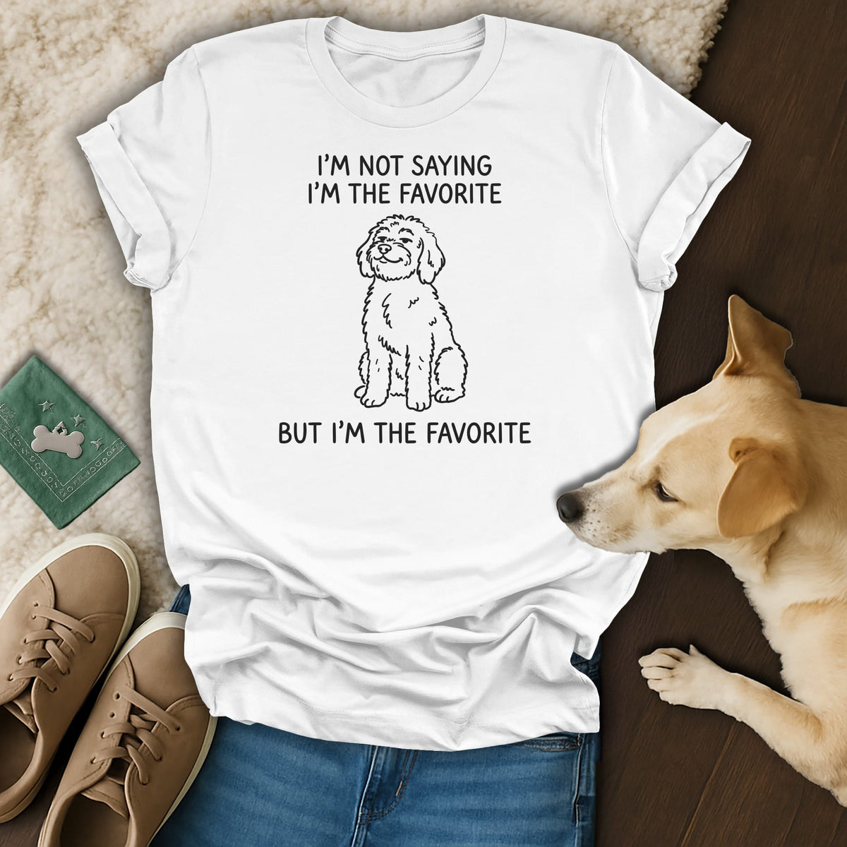 White t-shirt with line drawing of a dog and text "I'm Not Saying I'm The Favorite But I'm The Favorite".