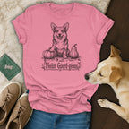 Pink t-shirt with a corgi, pumpkins, and text "Feelin' Gourd-geous".