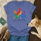 T-shirt with colorful dog silhouettes and text "but first, coffee and a whole lot of dogs".