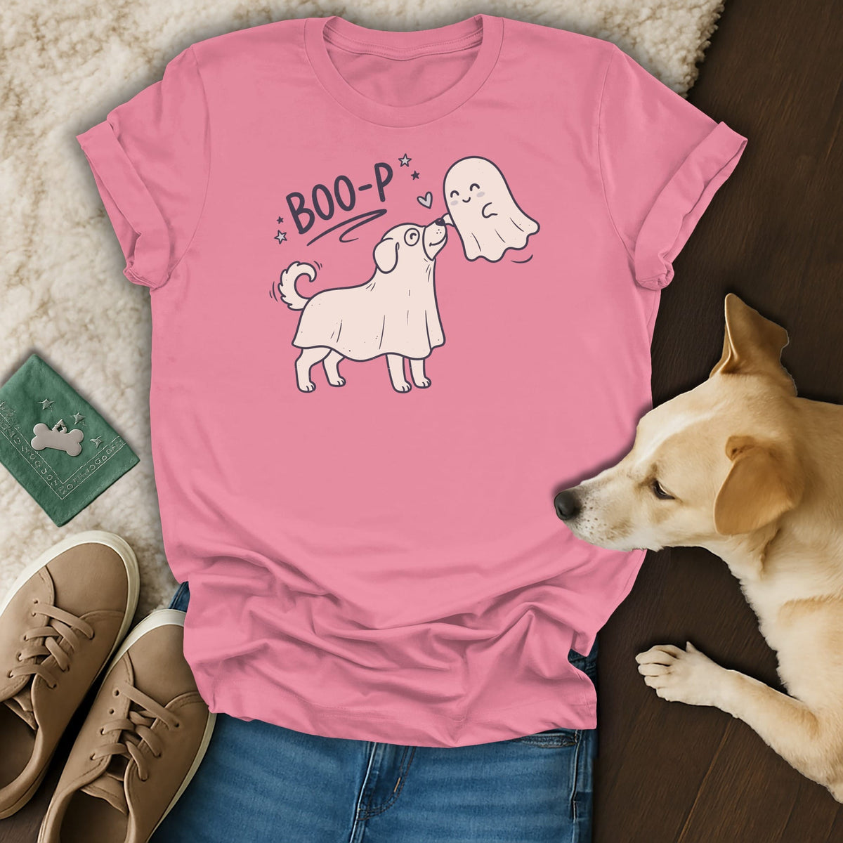 Pink t-shirt with "Boo-p" text and illustration of a dog dressed as a ghost meeting a friendly ghost.