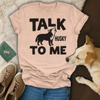 Peach t-shirt with "TALK TO ME HUSKY" and silhouette of a howling husky.