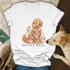 A white V-neck t-shirt displays a floral doodle dog graphic with the text DOODLE MAMA below.