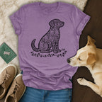 Purple t-shirt with a dog silhouette filled with heart patterns.