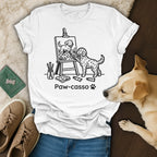 Dog painting a dog on an easel, with "Paw-casso" text.