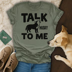 Olive green t-shirt with "TALK HUSKY TO ME" text and husky silhouette.