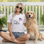 Woman and golden retriever with American flag design on t-shirt.