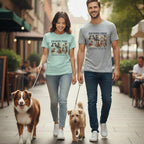 Couple walking dogs, wearing t-shirts with "Founding Fidos" text and patriotic dogs.