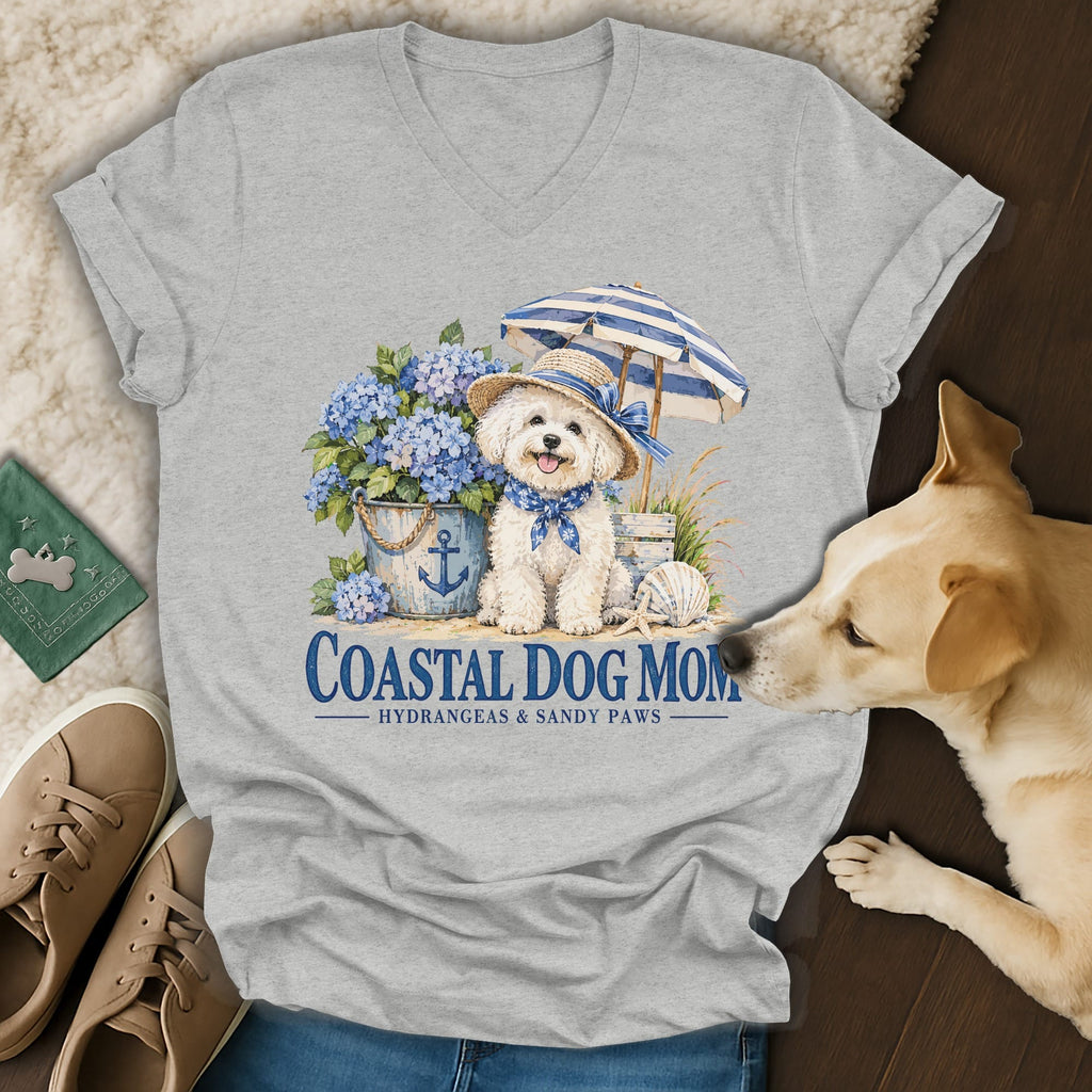 Heather gray V-neck T-shirt featuring a graphic of a dog, hydrangeas, umbrella, and text that reads Coastal Dog Mom.