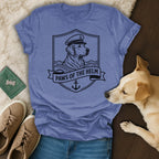 Golden retriever wearing captain's hat on shield with "Paws of the Helm" text.