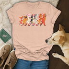 T-shirt with multiple cartoon dogs roller skating in a line.