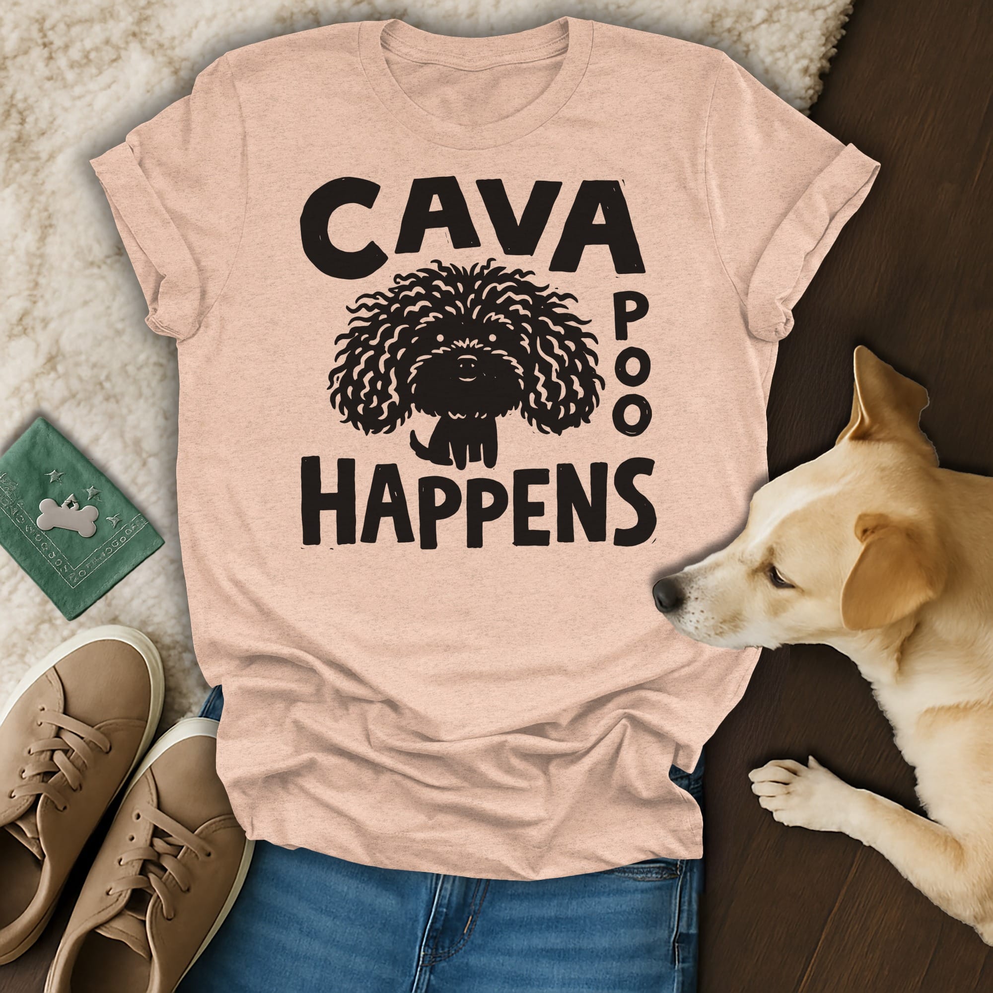 Peach t-shirt with black text and a cartoon dog: "CAVA POO HAPPENS".