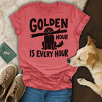 T-shirt with "Golden Hour Is Every Hour" and a dog holding a stick.