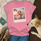 Pink t-shirt with a framed image of a dog wearing heart sunglasses eating ice cream.