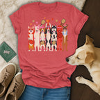 T-shirt displaying cartoon dogs playing pickleball and holding a trophy.