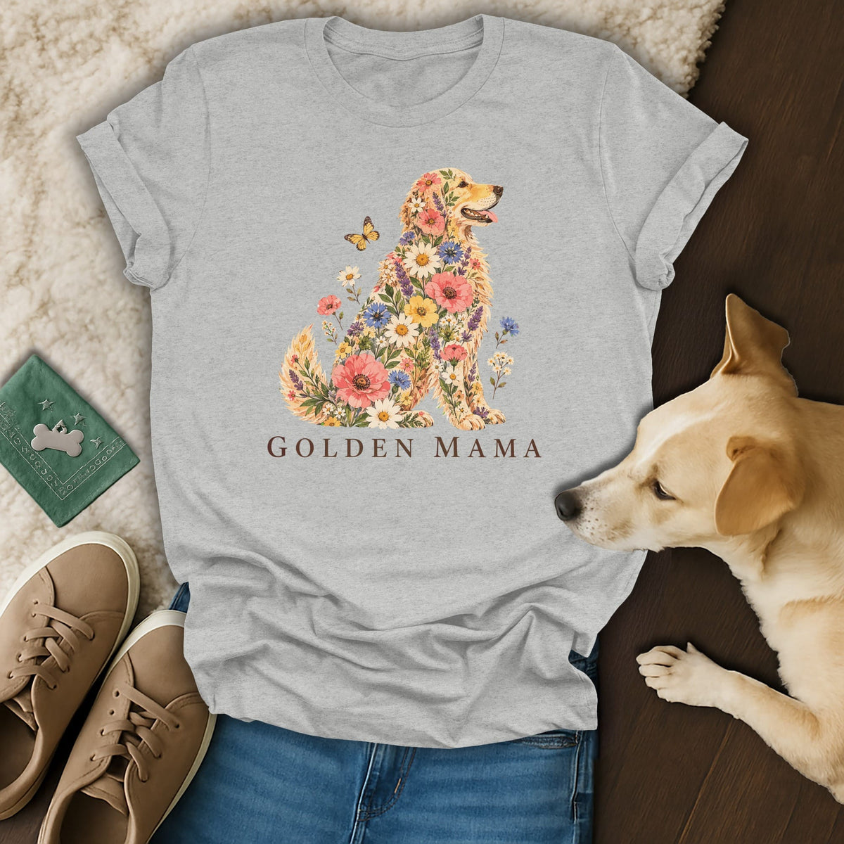 A grey t-shirt featuring a Golden Retriever illustration made of colorful flowers with the text Golden Mama.