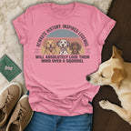 Pink t-shirt with dogs and text "Rewrote history. Inspired legends. Will absolutely lose their mind over a squirrel."