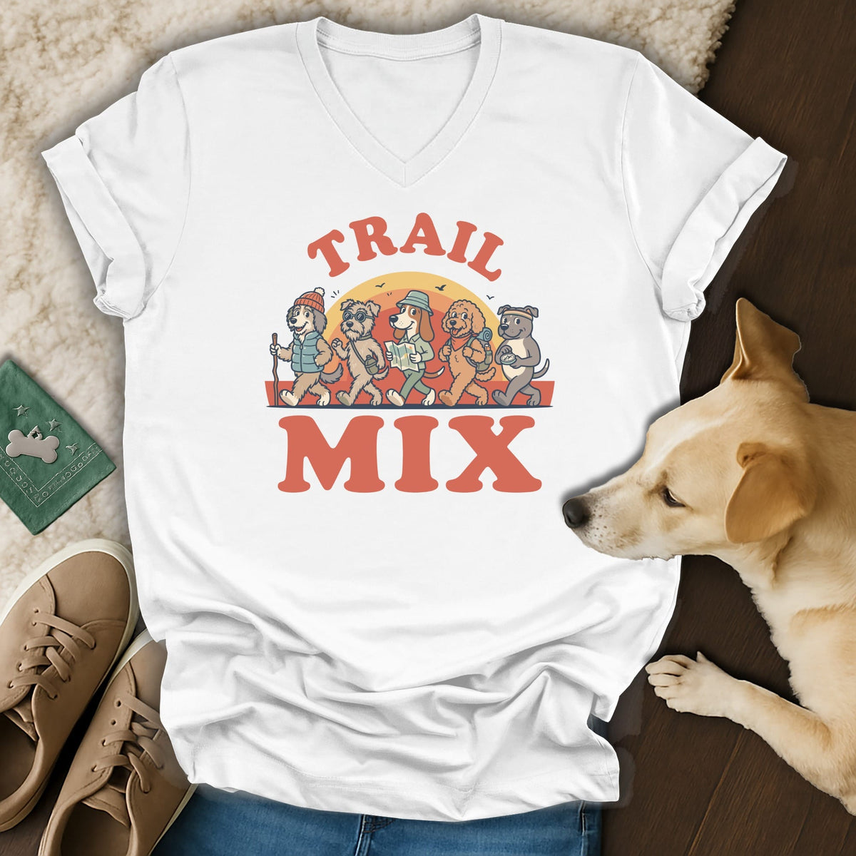 White t-shirt with cartoon dogs hiking and the text "TRAIL MIX".