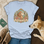 A light blue t-shirt with a "Senior Dog Mom" graphic featuring a golden retriever in a floral frame.