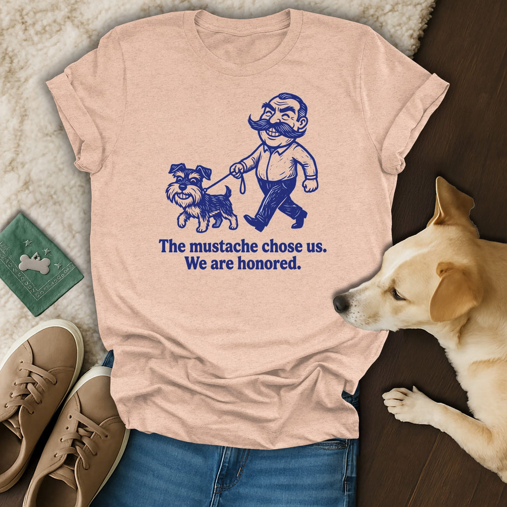 T-shirt with illustration of man and dog, text "The mustache chose us. We are honored."