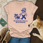 T-shirt with illustration of man and dog, text "The mustache chose us. We are honored."