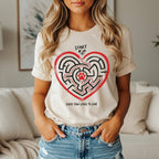 Beige t-shirt with a heart-shaped maze graphic and the text "START" and "EVERY PAW LEADS TO LOVE."