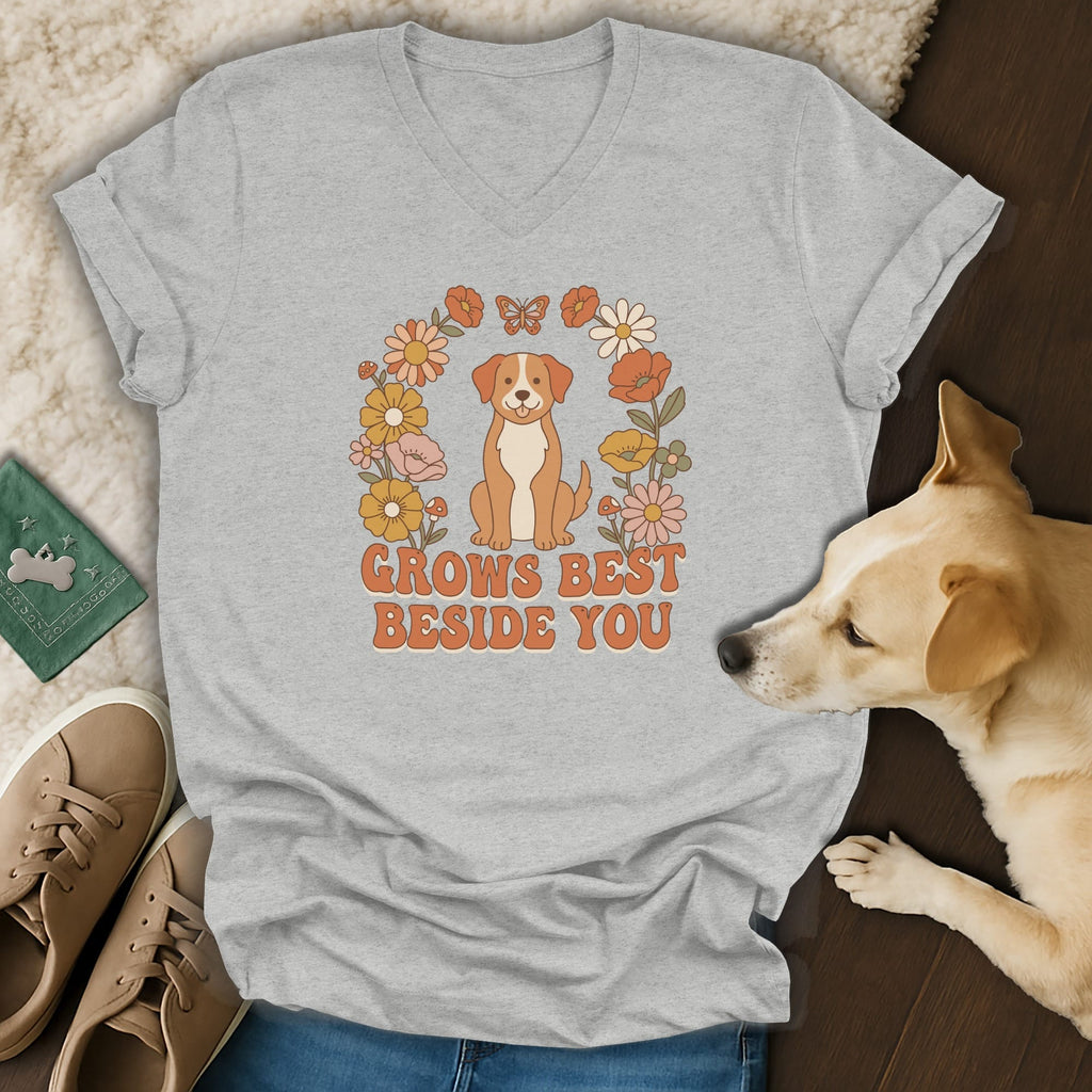 Heather gray V-neck t-shirt featuring a retro cartoon dog, floral wreath, and the text GROWS BEST BESIDE YOU.