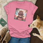 Pink t-shirt with a graphic of a dog in sunglasses on a float.