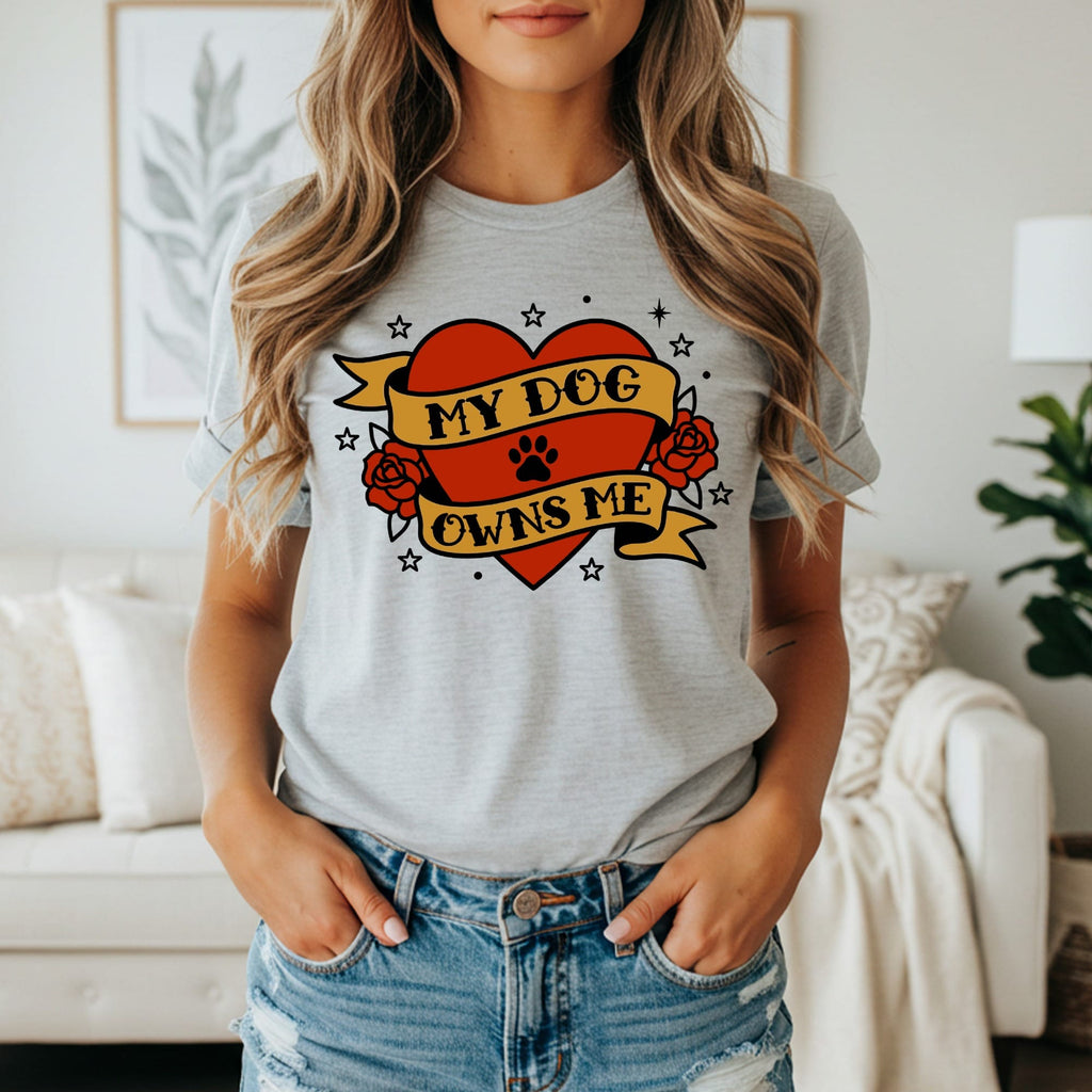 Gray t-shirt with heart banner saying "My Dog Owns Me".