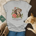 Heather gray t-shirt featuring a botanical illustration of an older dog and pink roses with text reading Gray Muzzle Rose.