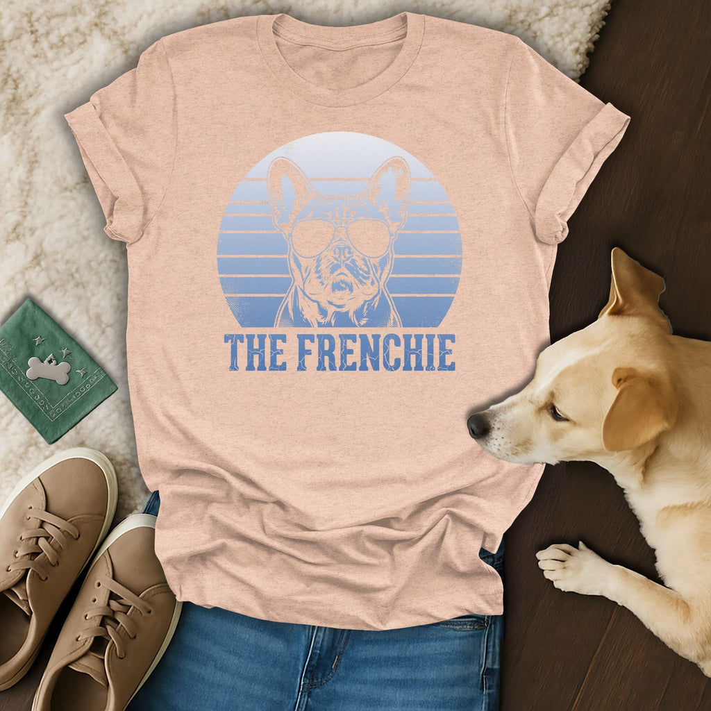 Peach t-shirt with a graphic of a French bulldog wearing sunglasses and text "THE FRENCHIE".