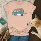 T-shirt with cartoon dogs driving a van, hearts, and travel items.