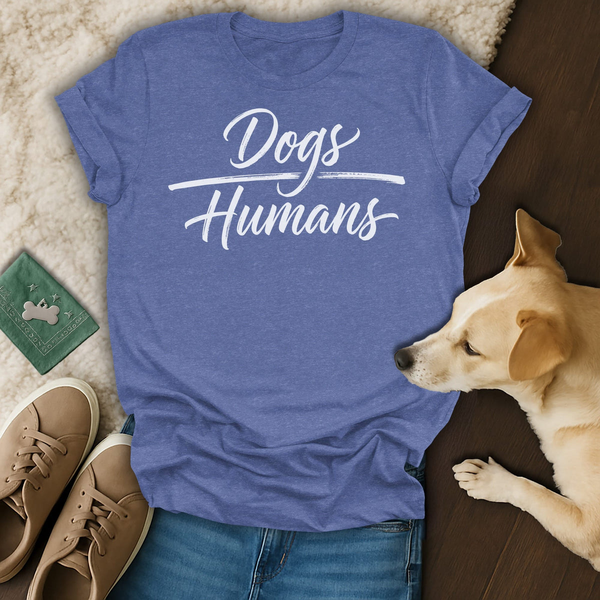 Blue t-shirt with white text "Dogs Humans" and a dog.