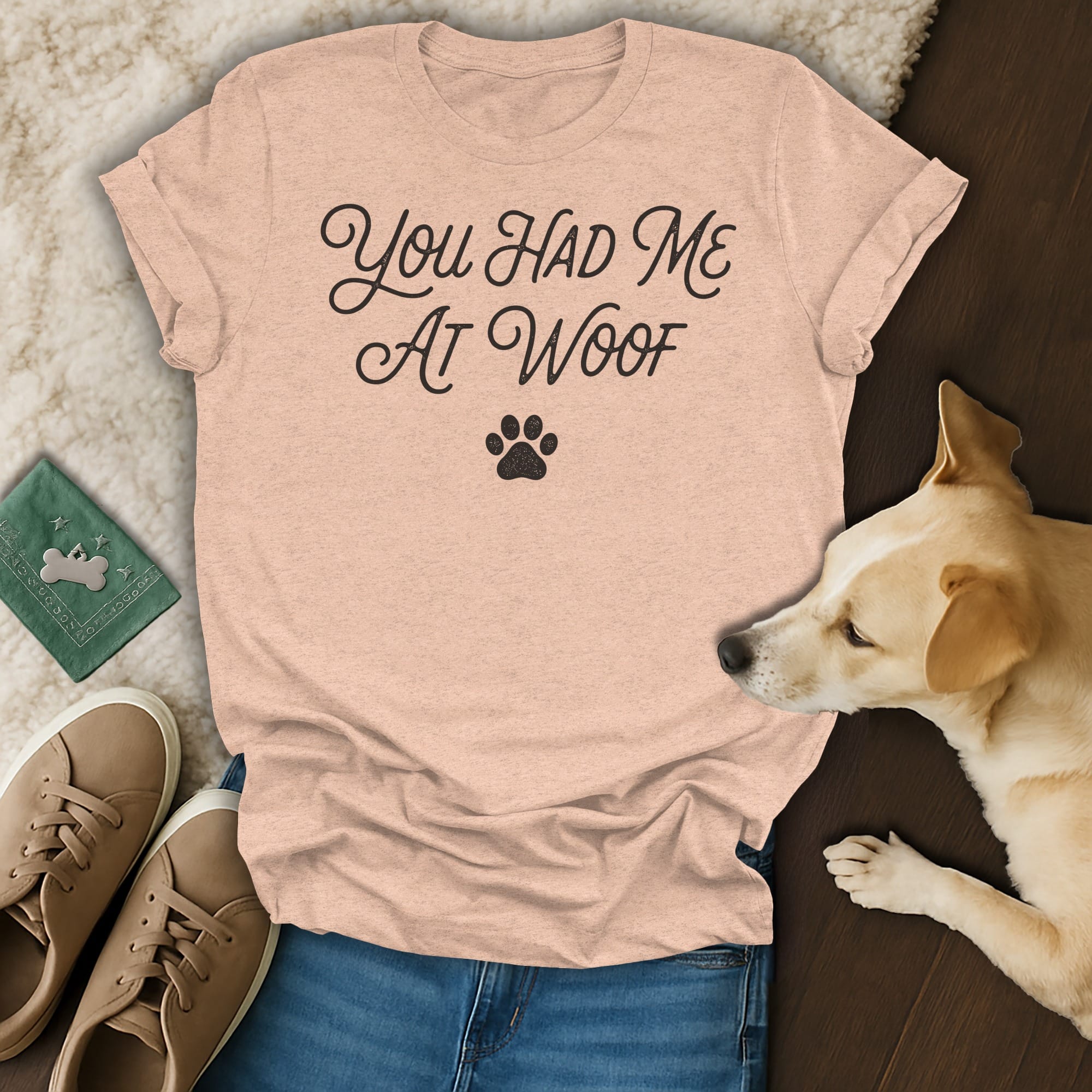Peach t-shirt with "You Had Me At Woof" text and paw print.